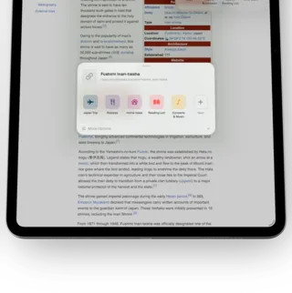 ToMe on a iPad, angled — The ToMe share sheet over a Safari page, offering a row of spaces to save into